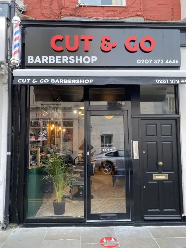 The Cut & Go shopfront on Kenway Road, with red lettering on a black fascia